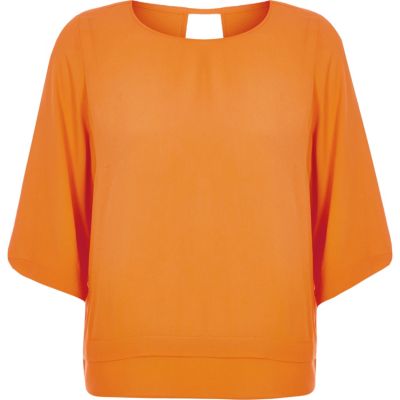 Orange layered hem top